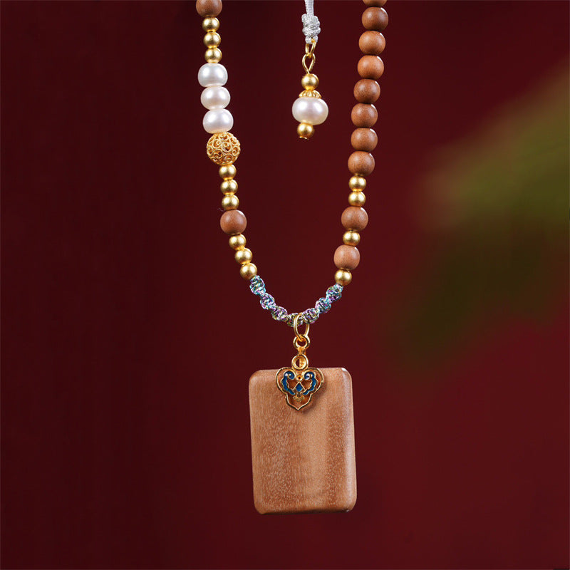 Sandalwood pendant, Lao Shan Tan Ping An Wu Pai, paired with pearl auspicious cloud bead necklace