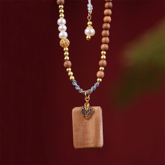 Sandalwood pendant, Lao Shan Tan Ping An Wu Pai, paired with pearl auspicious cloud bead necklace